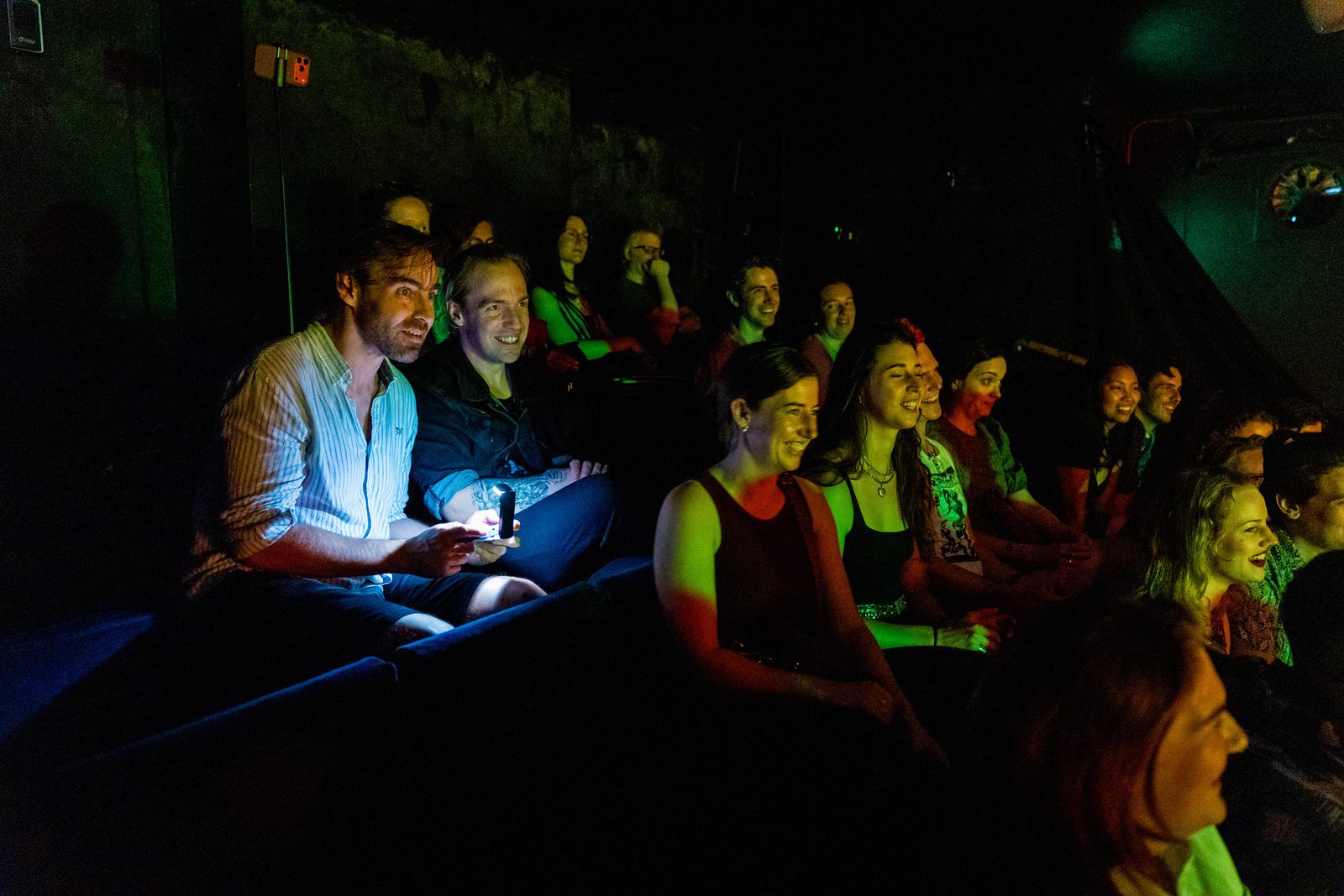 The audience of Karate Man, laughing and playing