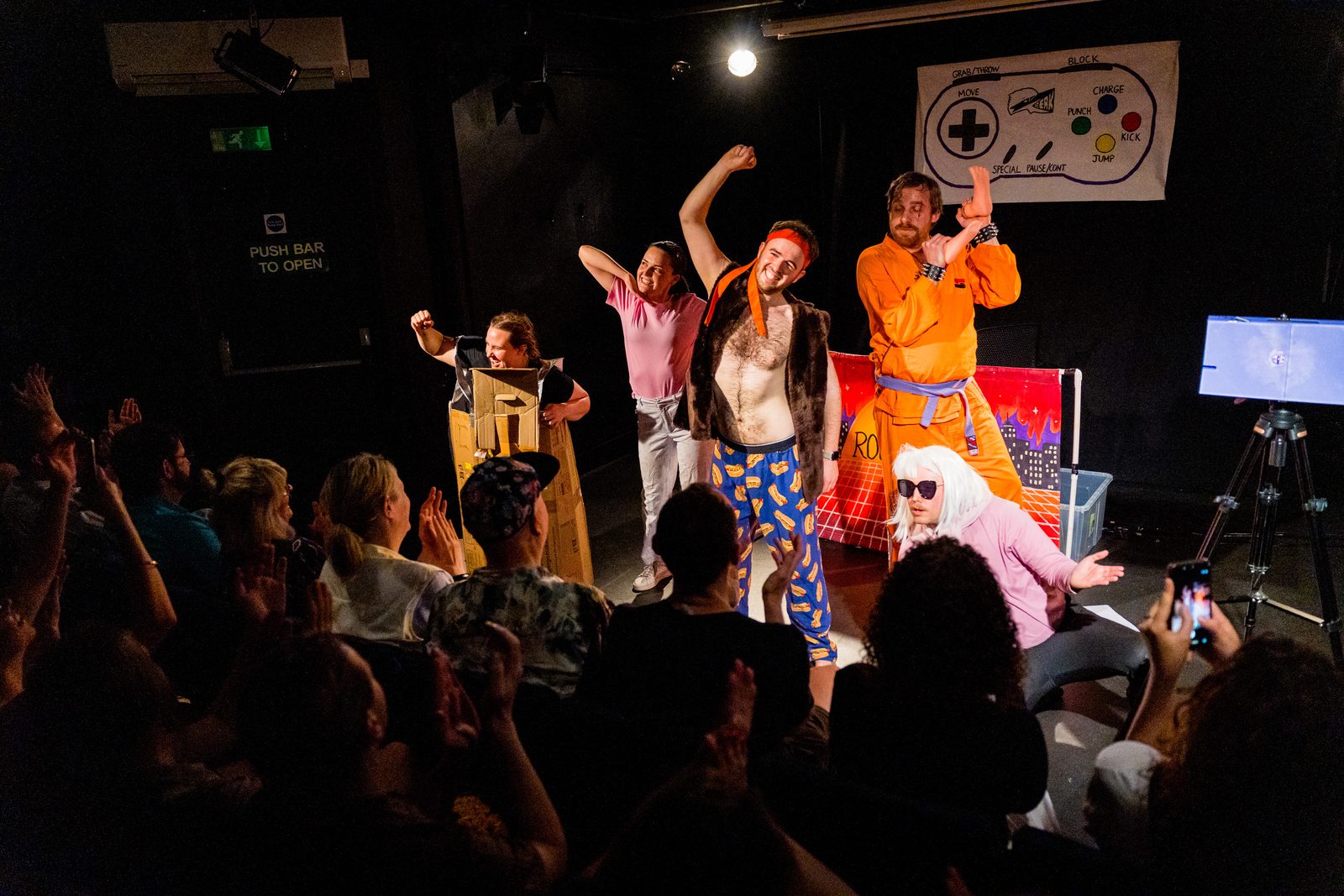 The cast of Karate Man posed together on stage